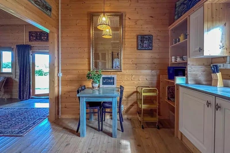 Romantic wooden cottage with lots of art