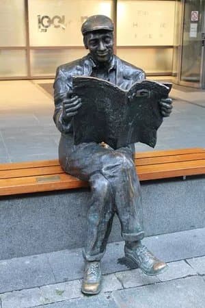 Sculpture of man reading VG