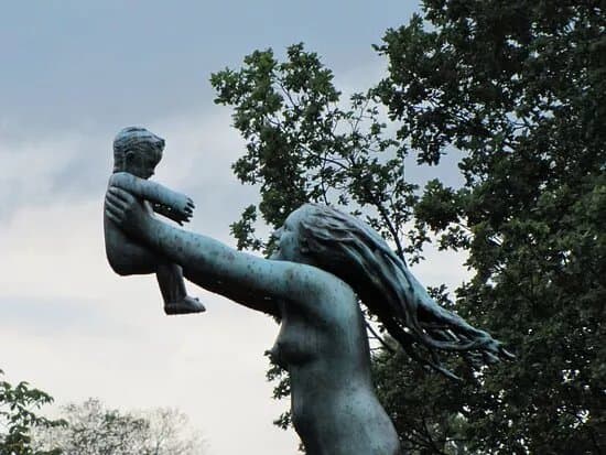 Woman Running And Lifting A Child