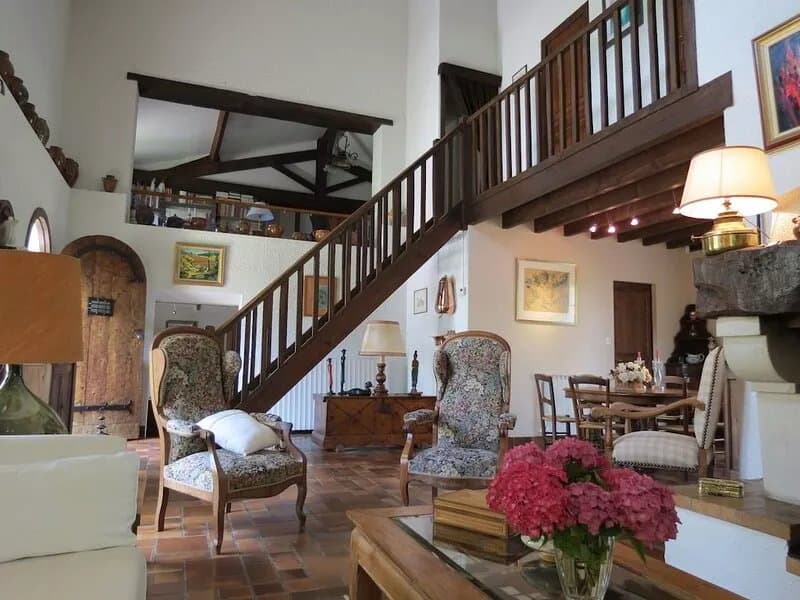Charming stone house in a park with trees on the hillsides of Bordeaux