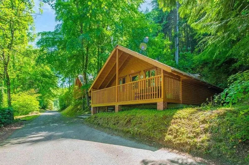 Timber lodge set in an elevated position with views of the lakes.