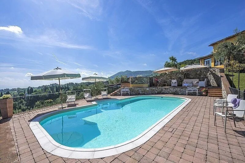 Villa Cordelia: A charming two-story villa surrounded by the greenery, with