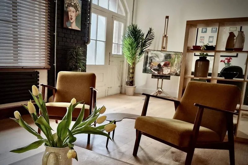 Spacious studio apartment with 20th Century Modern design in an industrial space