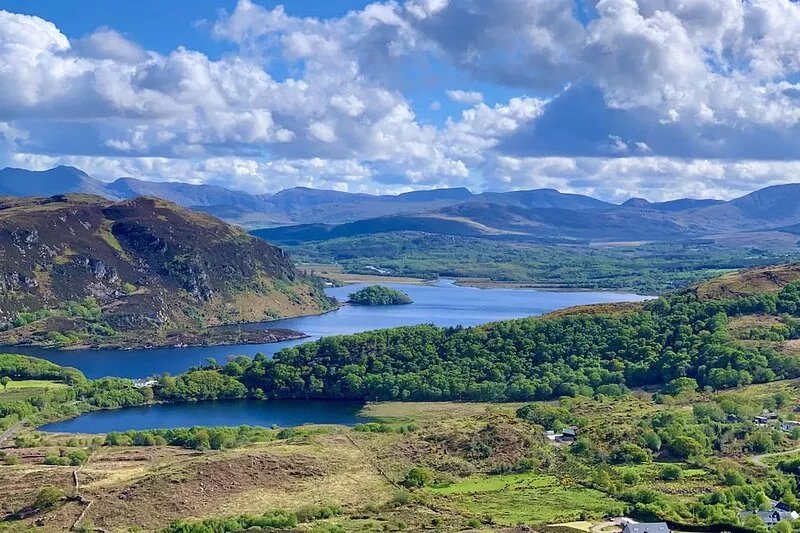 Secluded hamlet over lake and mountain, flocks of lambs and dams, stunning views