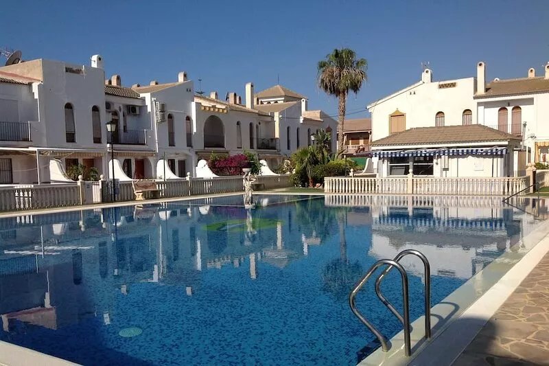 Delightful family villa in secure gated community with large pool.