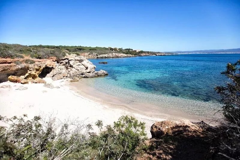 Tucked in vibrant Alghero Old Town, an inviting seaside home. Emerald