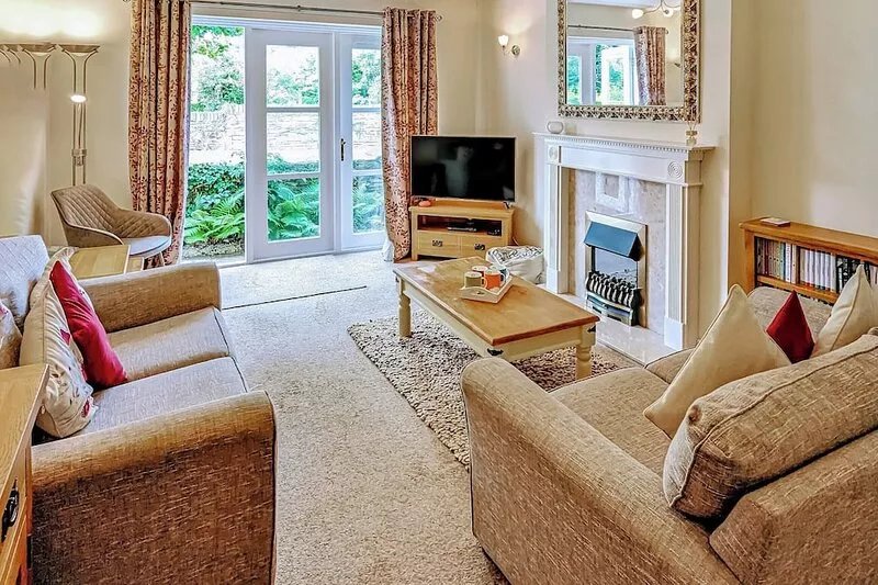 Attractive ground floor apartment with french windows onto small patio with