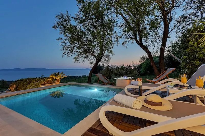 Holidayhome in a quiet location with pool&sea view, mini golf course& playground