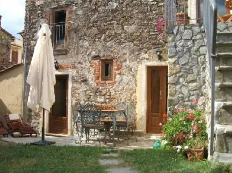 The old farmhouse among vineyards and olive groves