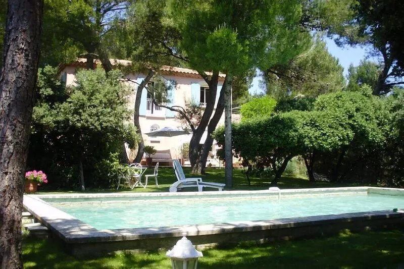 Provencal Bastide in the shadow of old pines and oaks