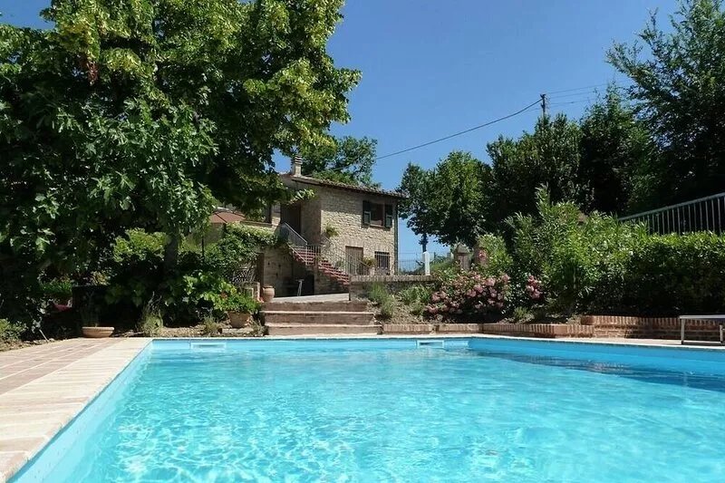 Idyllic character cottage set in landscaped garden with a private pool