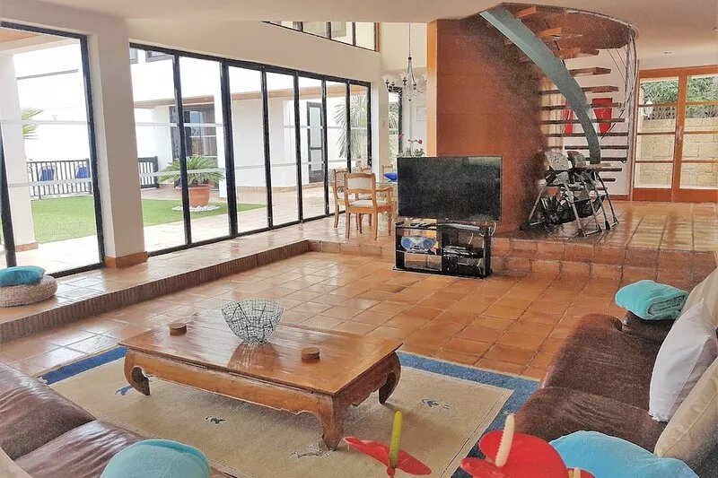 Villa with pool for exclusive group holiday under palm trees