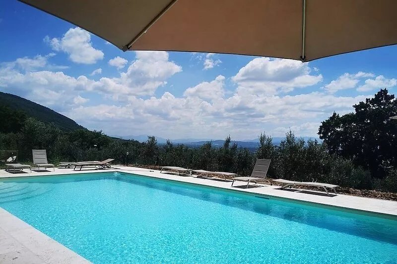 Villa Ovidia: A three-story age-old farm house surrounded by the greenery, with