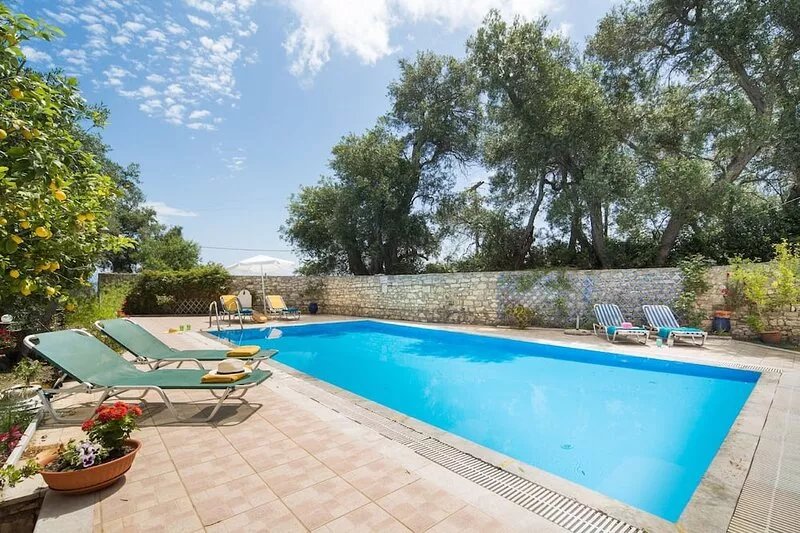 Indulge in Peace: A Paxos Sanctuary by the Olive Groves.