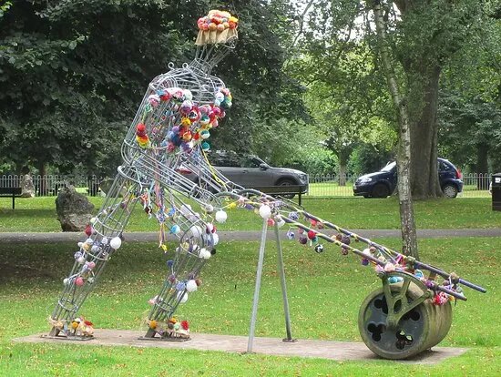 Mr. Granger Pushing A Lawnmower Sculpture