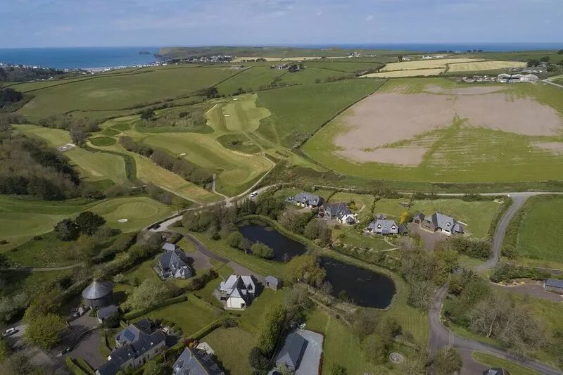 Overlooking the lakes of Roserrow, April Cottage is in an enviable location.