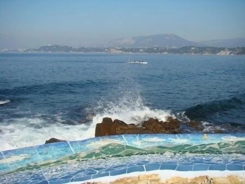 Feet in the water at the little port of Les Oursinières -