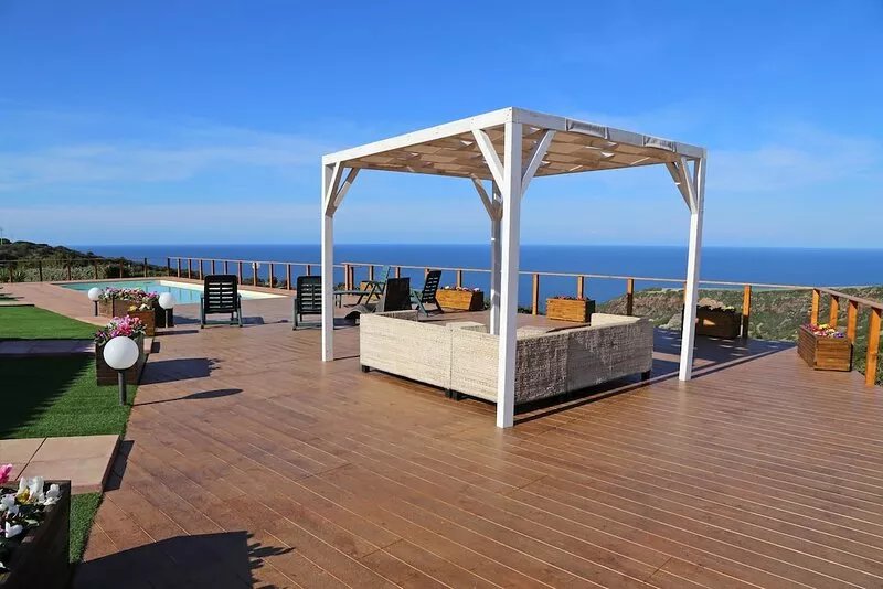 Bright villa with private pool, surrounded by lawn and sea view