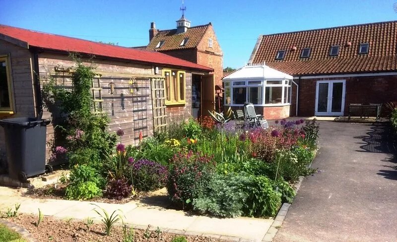 Holiday cottage in rural setting within quiet coastal village.