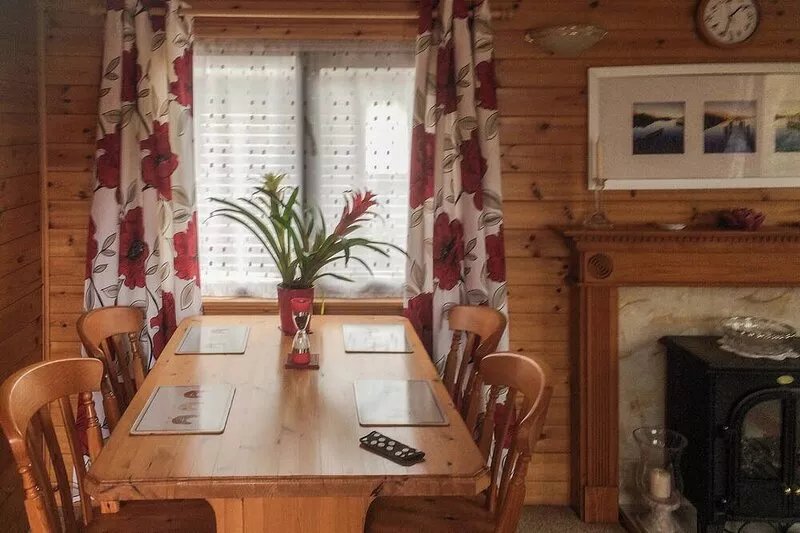Luxury pine log cabin situated in landscaped grounds with panoramic views of