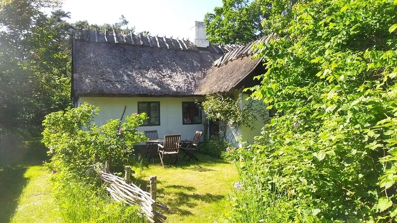 Idyllic old farmhouse in a protected scenic area near the forest and beach.