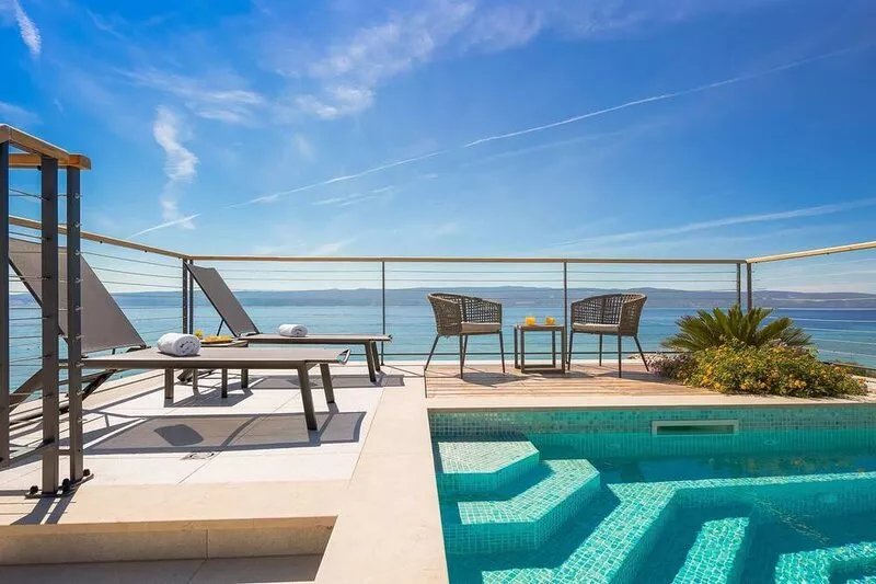 Luxury beachfront VILLA FLORES heated outdoor and indoor swimming pool