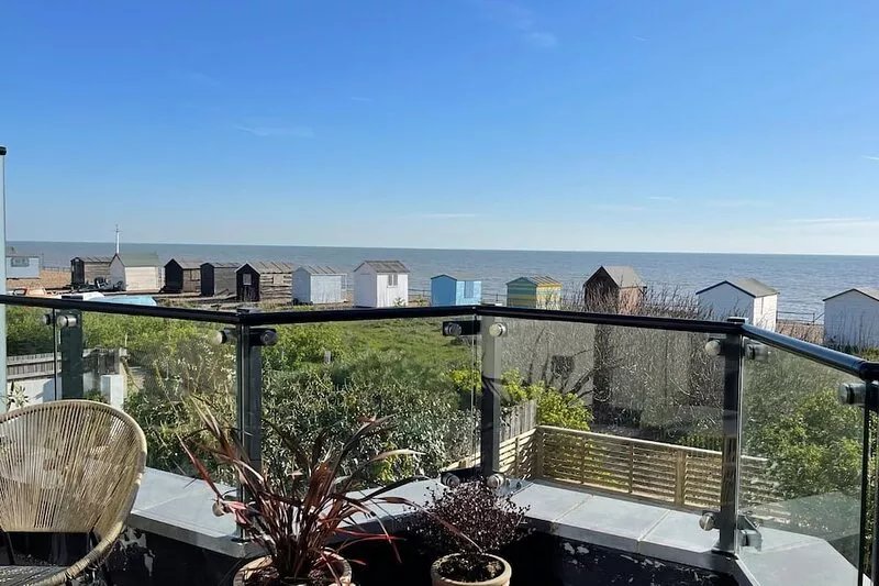 Stylish and spacious coastal retreat with sea views