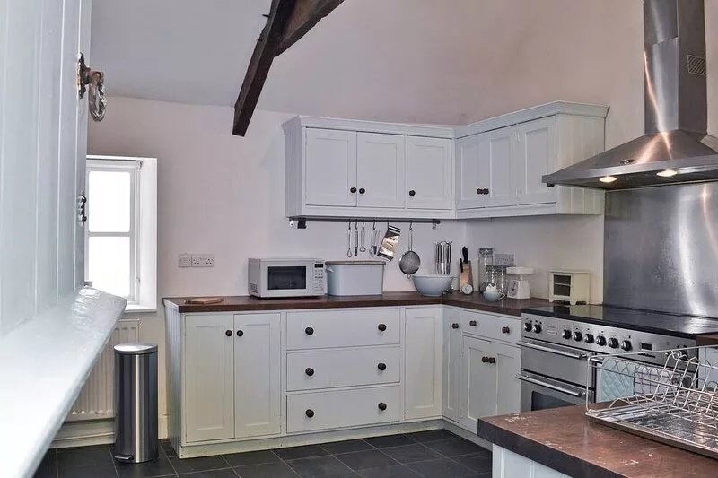 A detached character cottage with beams, wood burner and enclosed garden.