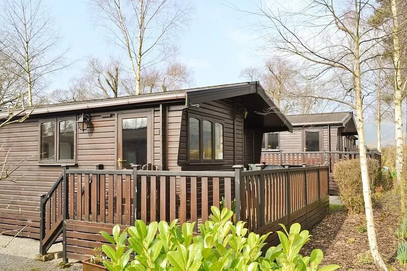 Luxury pine log cabin situated in landscaped grounds with panoramic views of