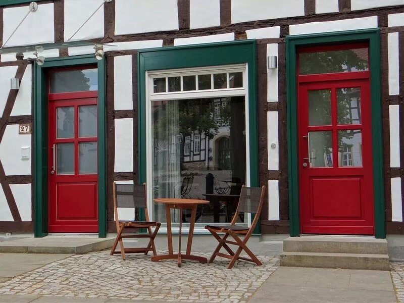 Modern apartment with a fireplace in a listed half-timbered house on the market