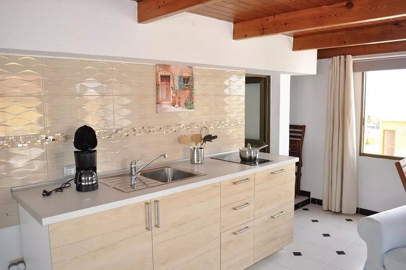 Charming house with mature gardens & self contained roof studio with sea views