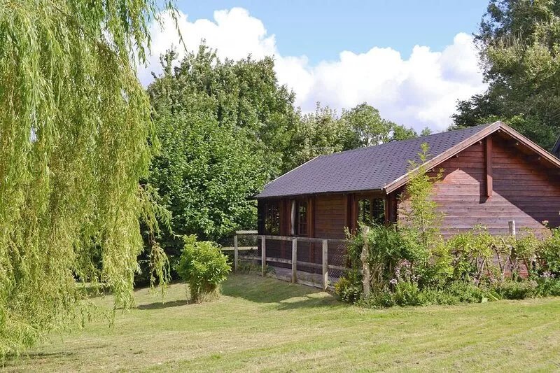 A stylish log cabin set in 25 acres with access to a games room and swimming