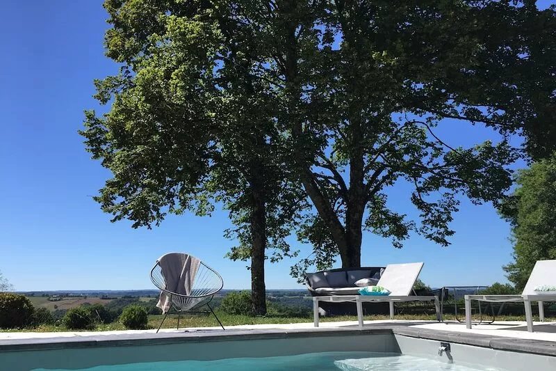 House with swimming pool surrounded by nature