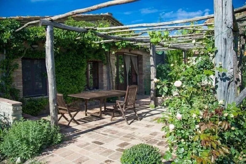 Farmhouse from 17th century with antique furniture and many flowers.