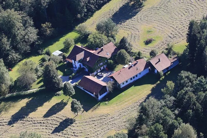 Former farmhouse in a forest clearing
