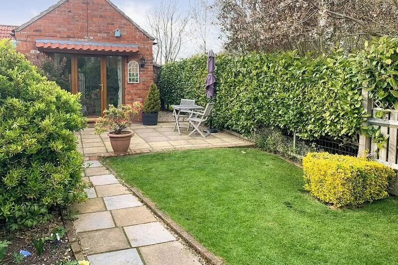 This coastal property is just 100 yards from the sand dunes and offers ground