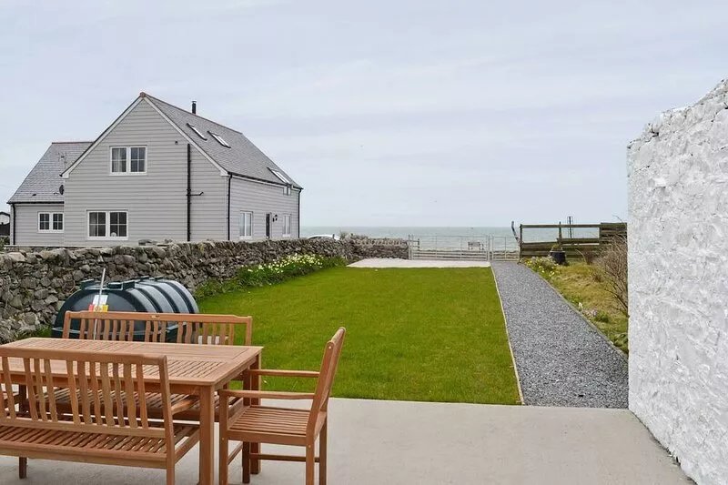 With direct access from the garden to a beach, this property truly is the