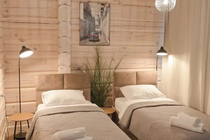 The house is located in a quiet area, surrounded by forest pines.