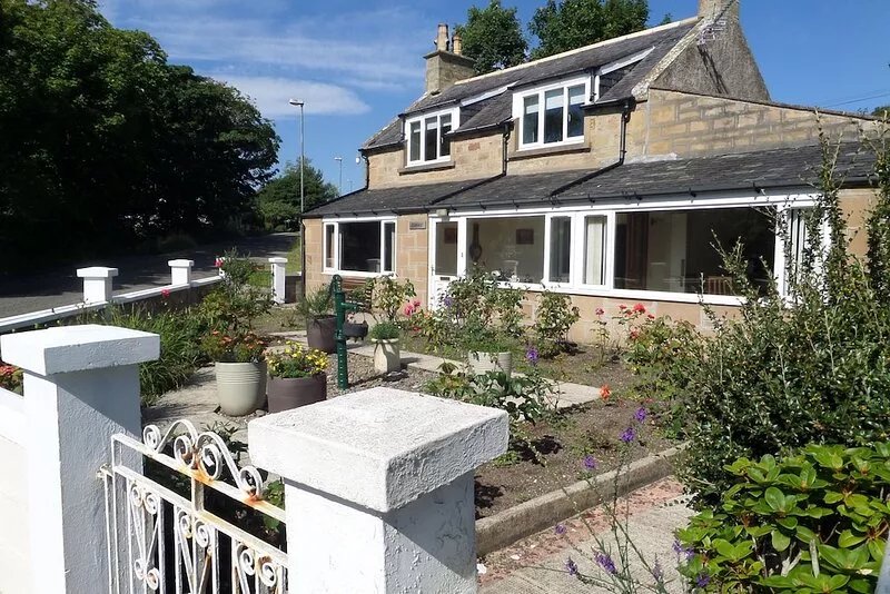 Charming, newly renovated cottage in Highland village location, with sea views.