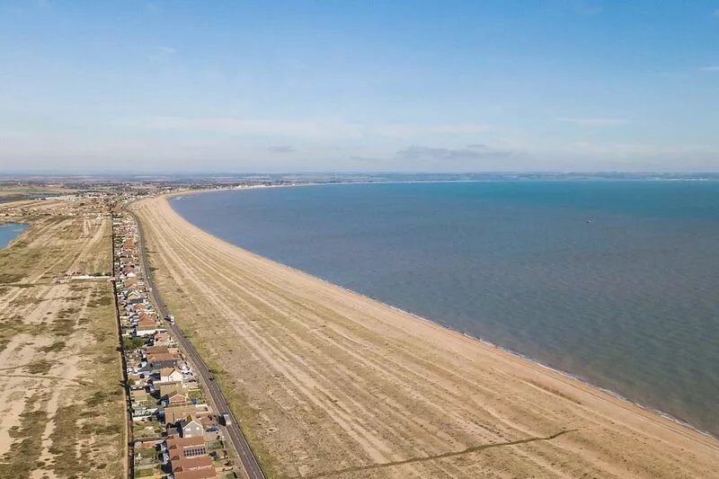 Quirky holiday cottage right on the beach at Dungeness in Kent.