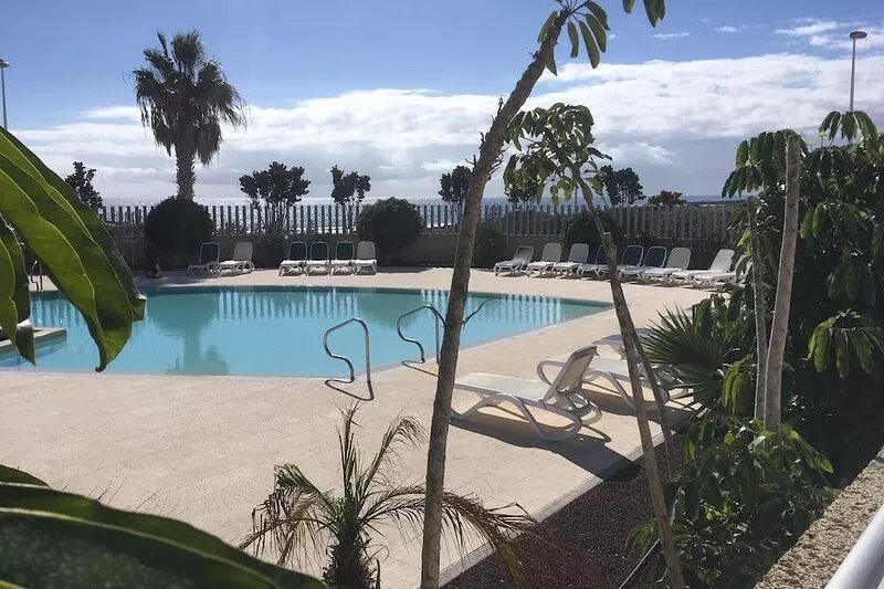 Modern two floor apartment right by the beach with pool, patio and paddle court