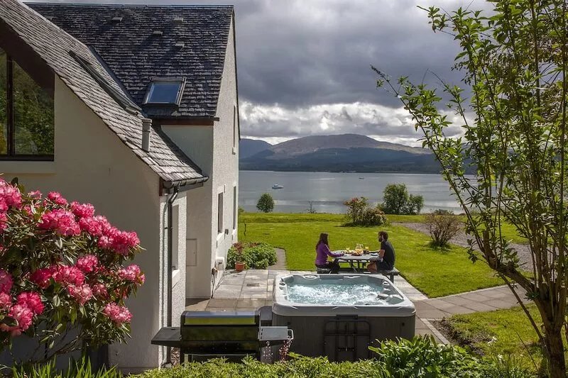 Large cottage  on shore of Scottish Loch