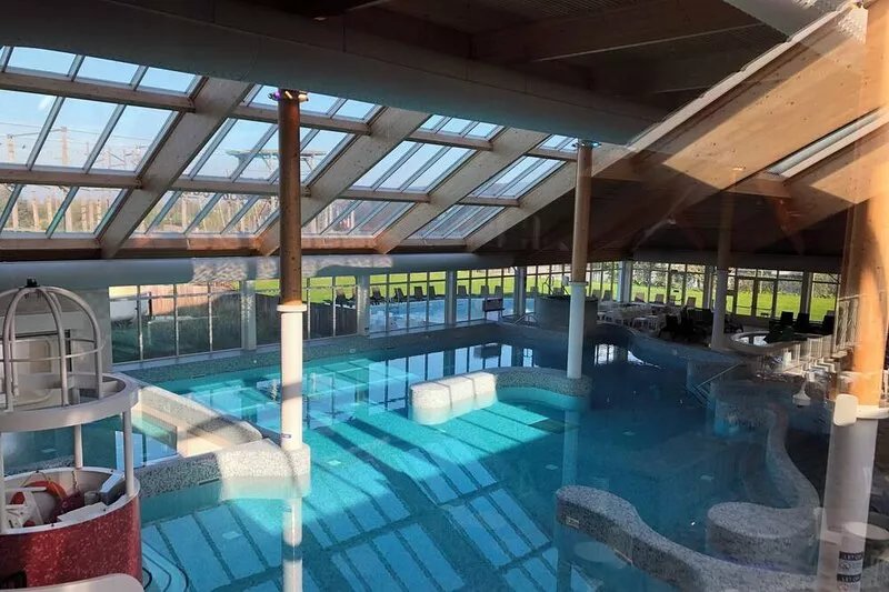 Luxury Bungalow for 2-6 people with fireplace in vacation park with swimming