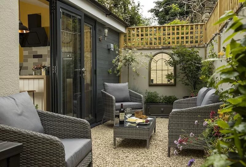 This charming Cotswold stone cottage, elegantly furnished with a seamless blend