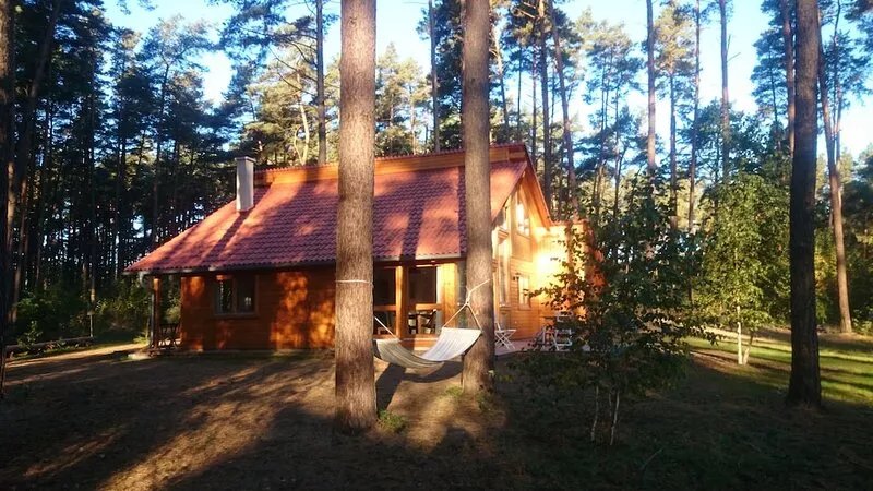 Stylish, bright wooden house by the forest in the immediate vicinity of a clear