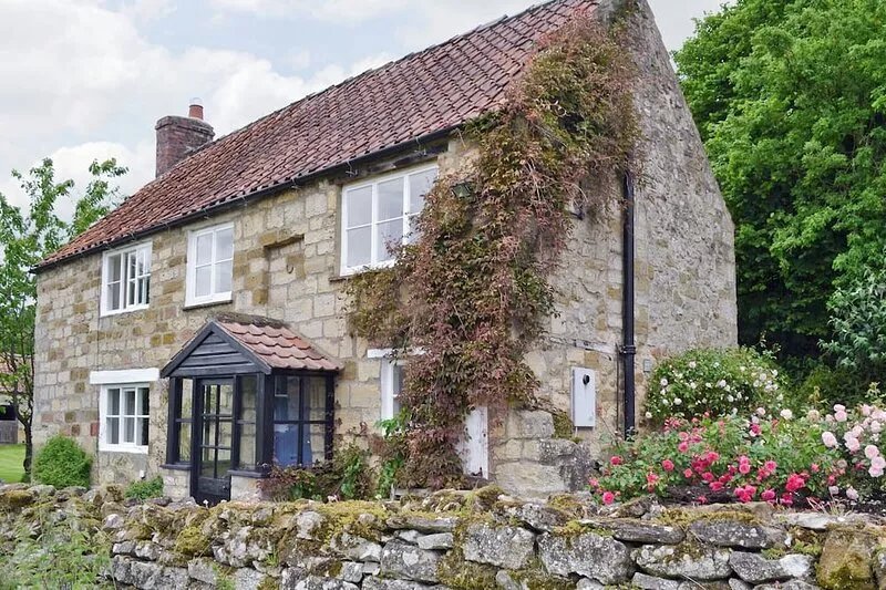 A detached character cottage with an open fire, overlooking Rievaulx Abbey.