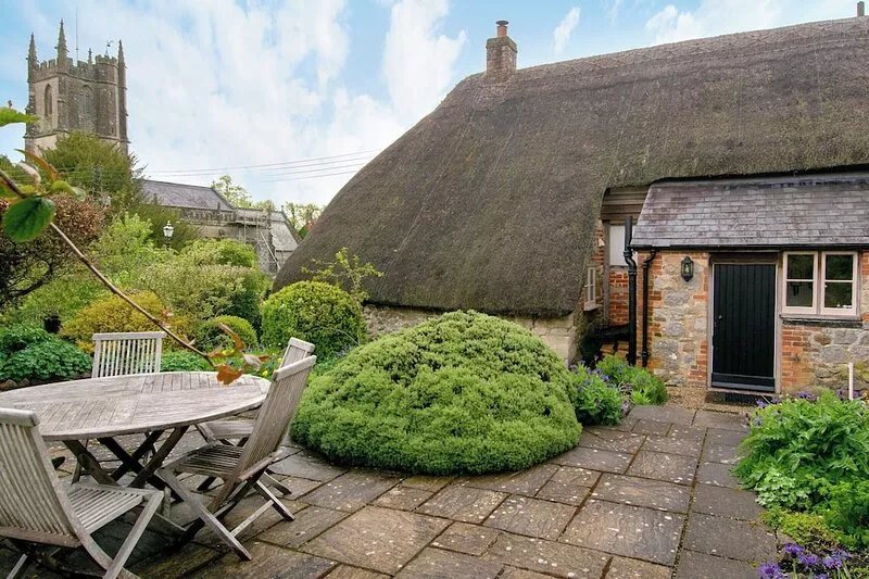 Step back in time in this traditional rustic thatched cottage with its original