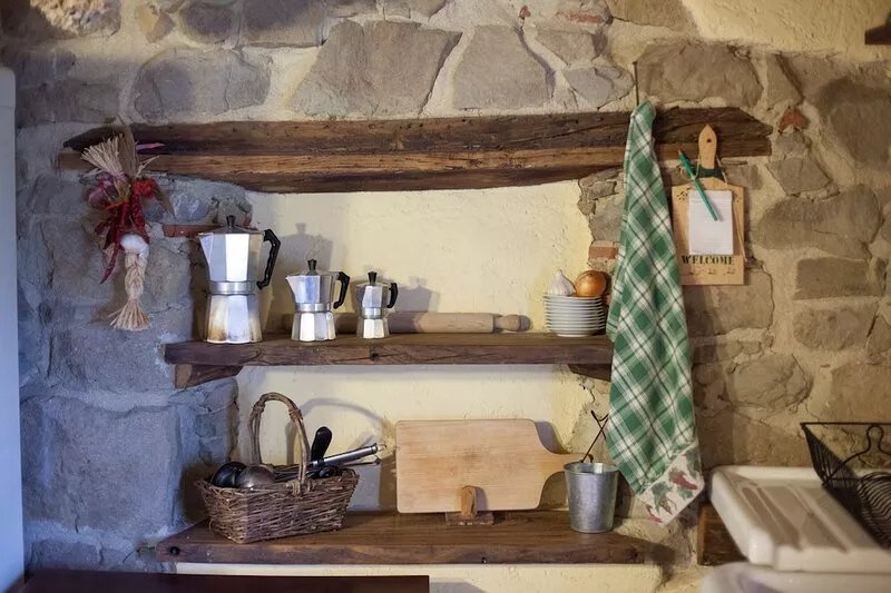 Stone Rustico with garden in an ancient village in Tuscany. View on ancient