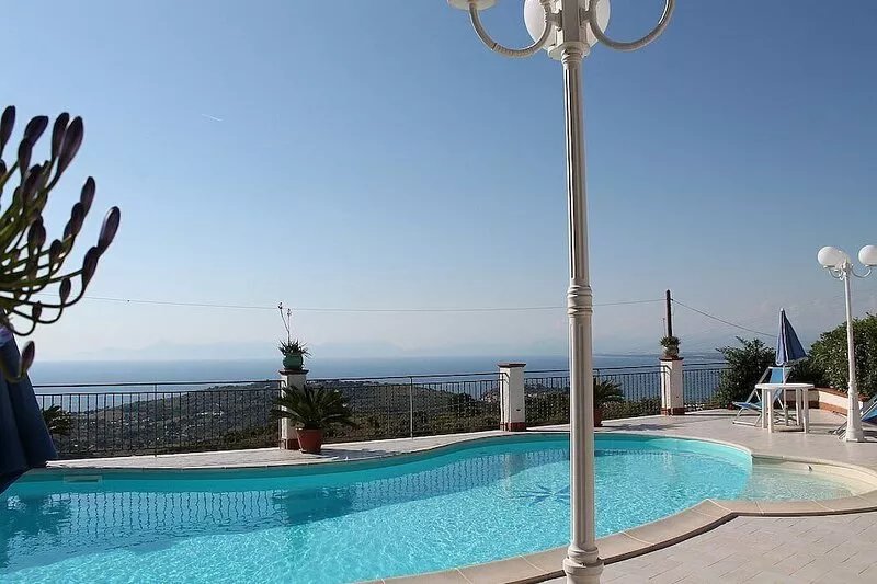 Villa Gioconda: A charming three-story villa located on a hillside, facing the