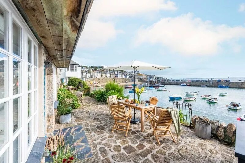 A beautifully refurbished stone cottage that sits right on Mousehole Harbour's